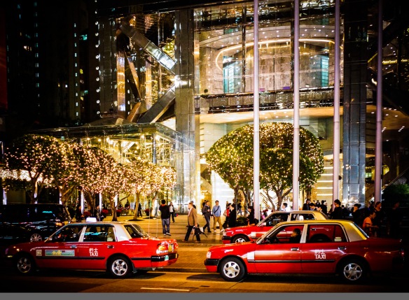 Three red cabs in a Hong Kong street